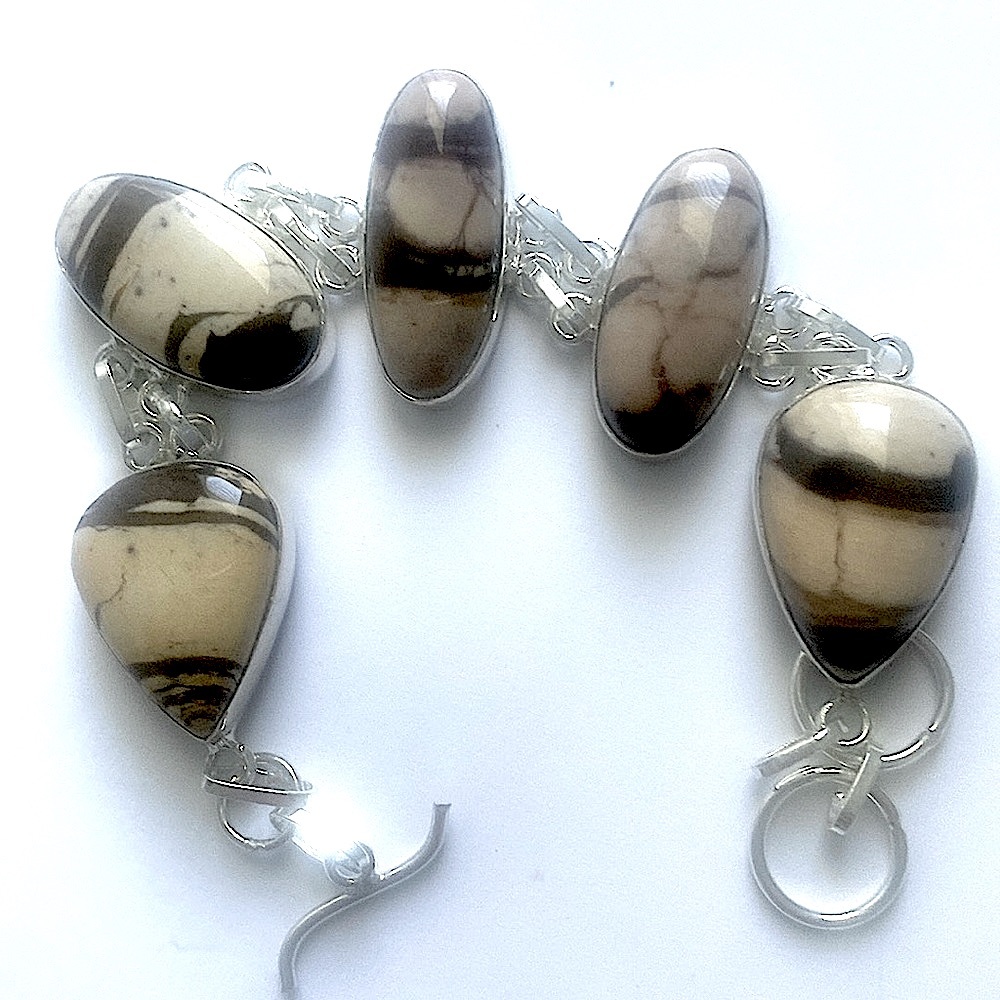 Beautiful 5 stone, 925 marked, Coconut Jasper bracelet size 8- 8 1/2